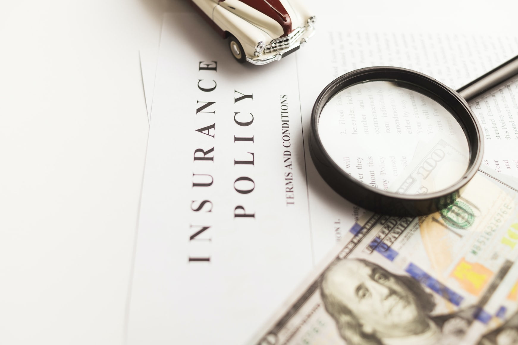 insurance-policy-doc-with-magnifying-glass